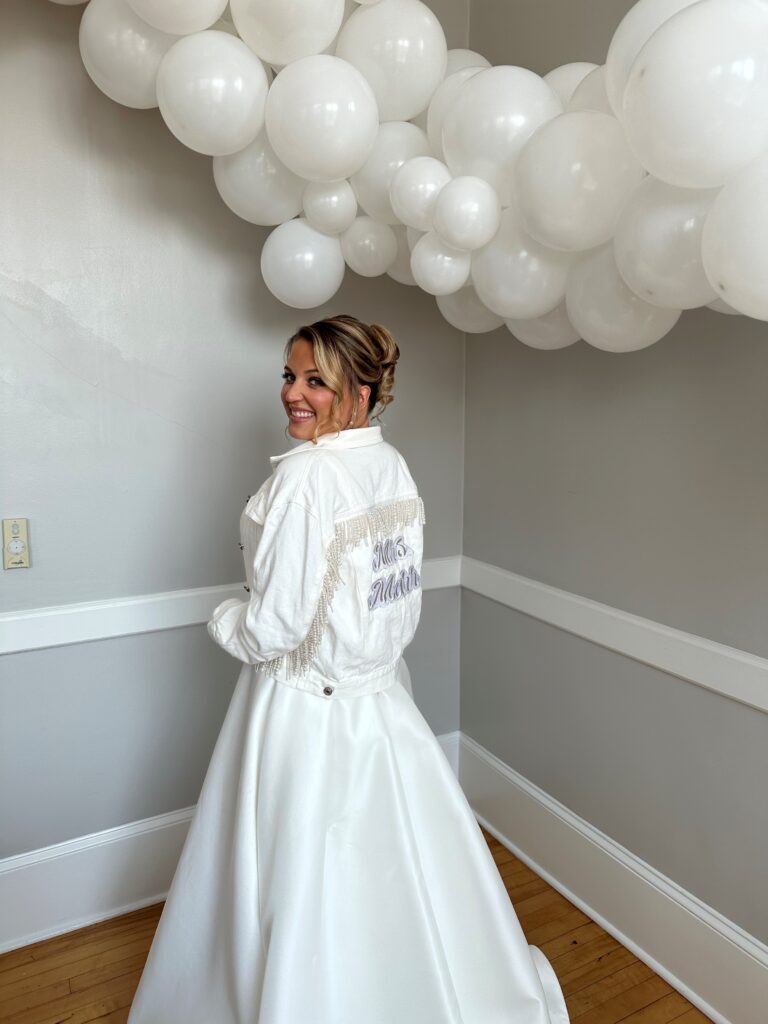 Bride with white balloon garland in Newport RI