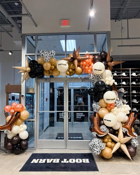 Custom balloon garland and arch for Boot Barn retail store in Rhode Island