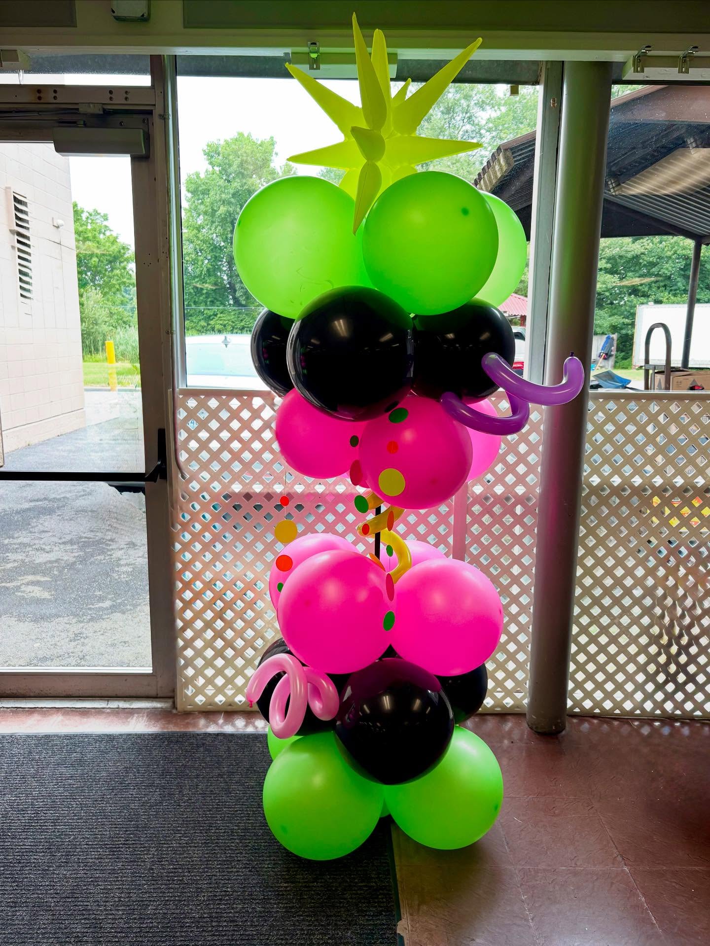Neon party balloon tower by Caliella