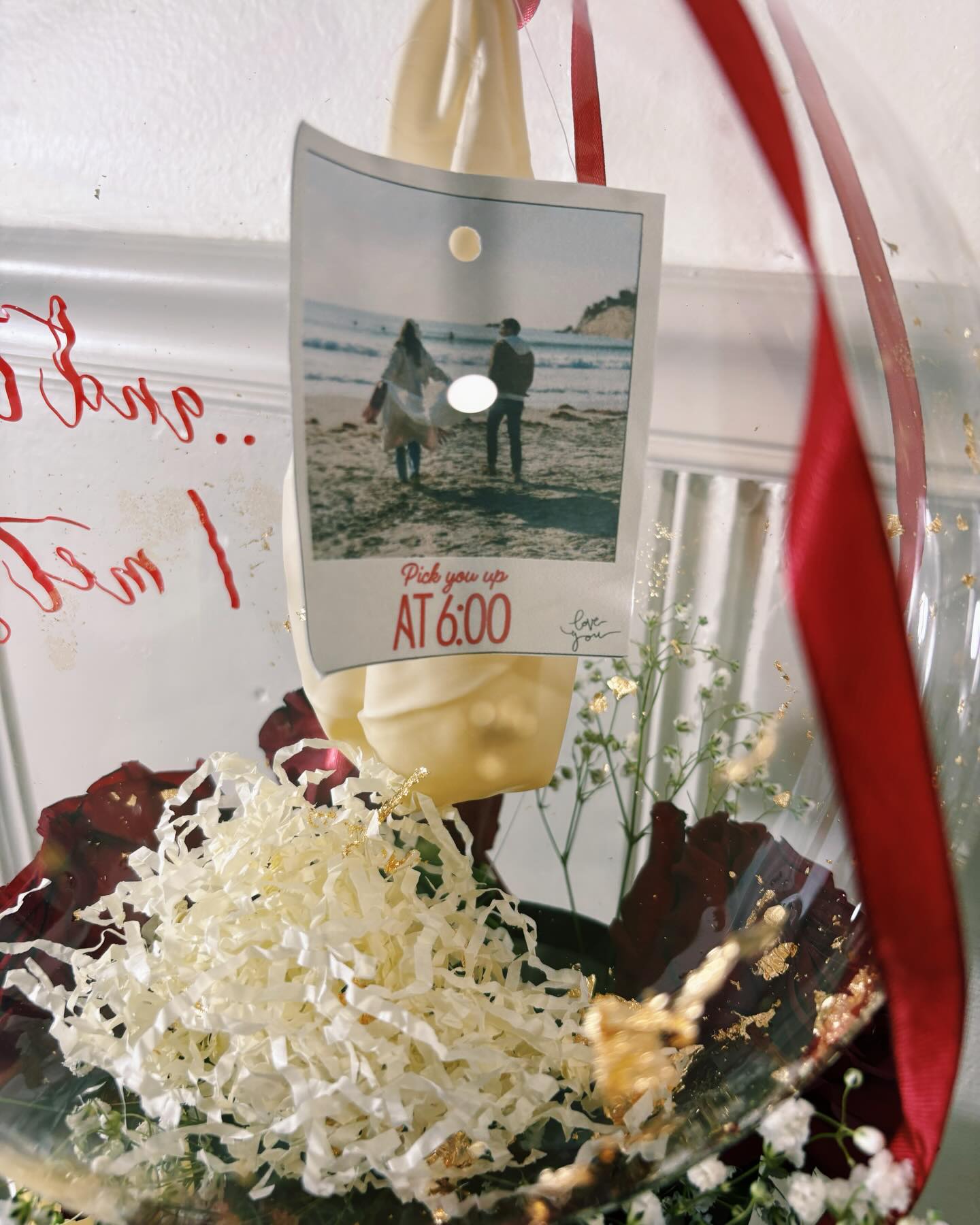 Photo reveal balloon with custom pickup message and romantic styling