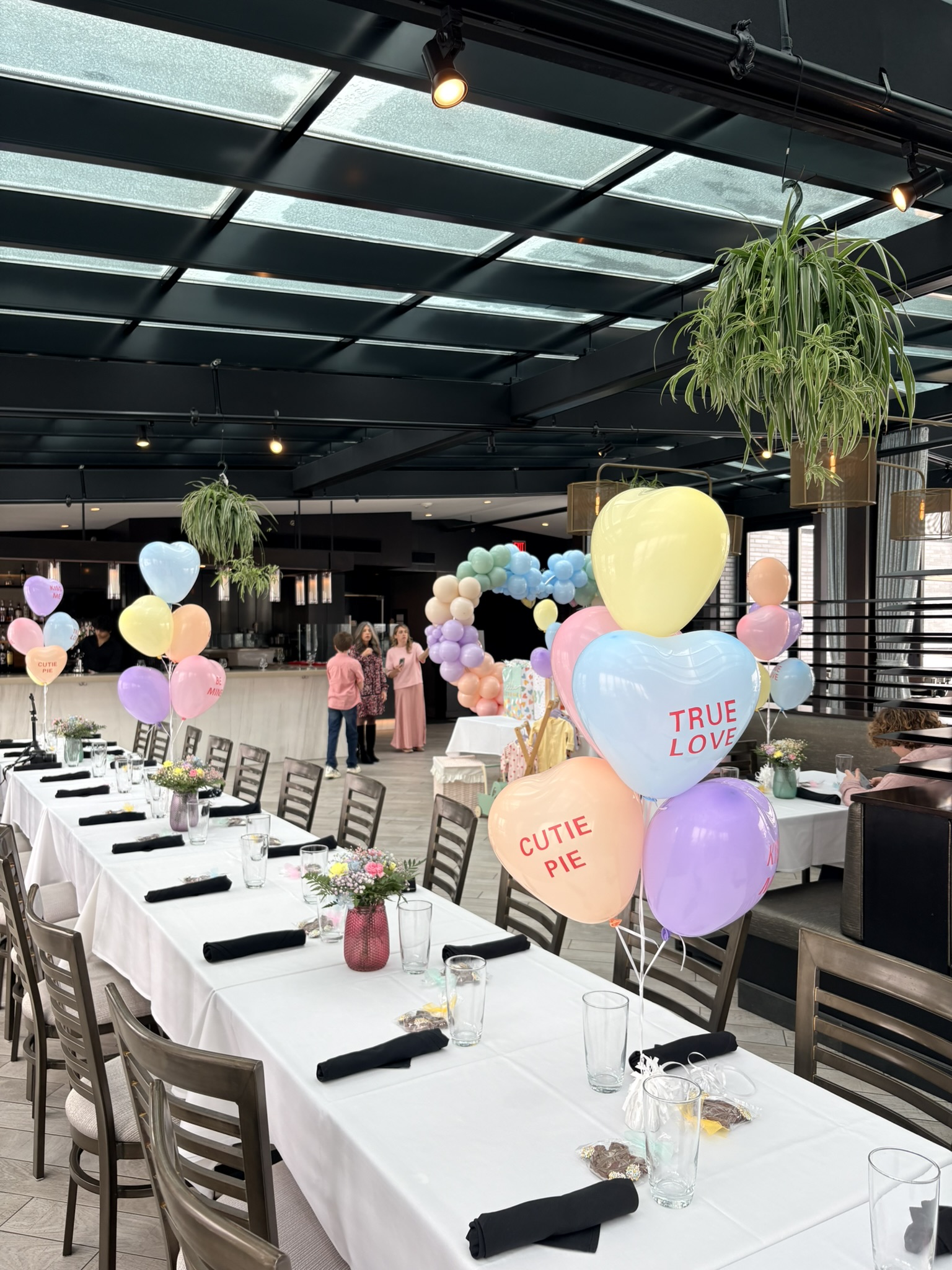 Valentine's baby shower balloon decorations at Mare Rooftop Providence Rhode Island with pastel conversation heart centerpieces by Caliella