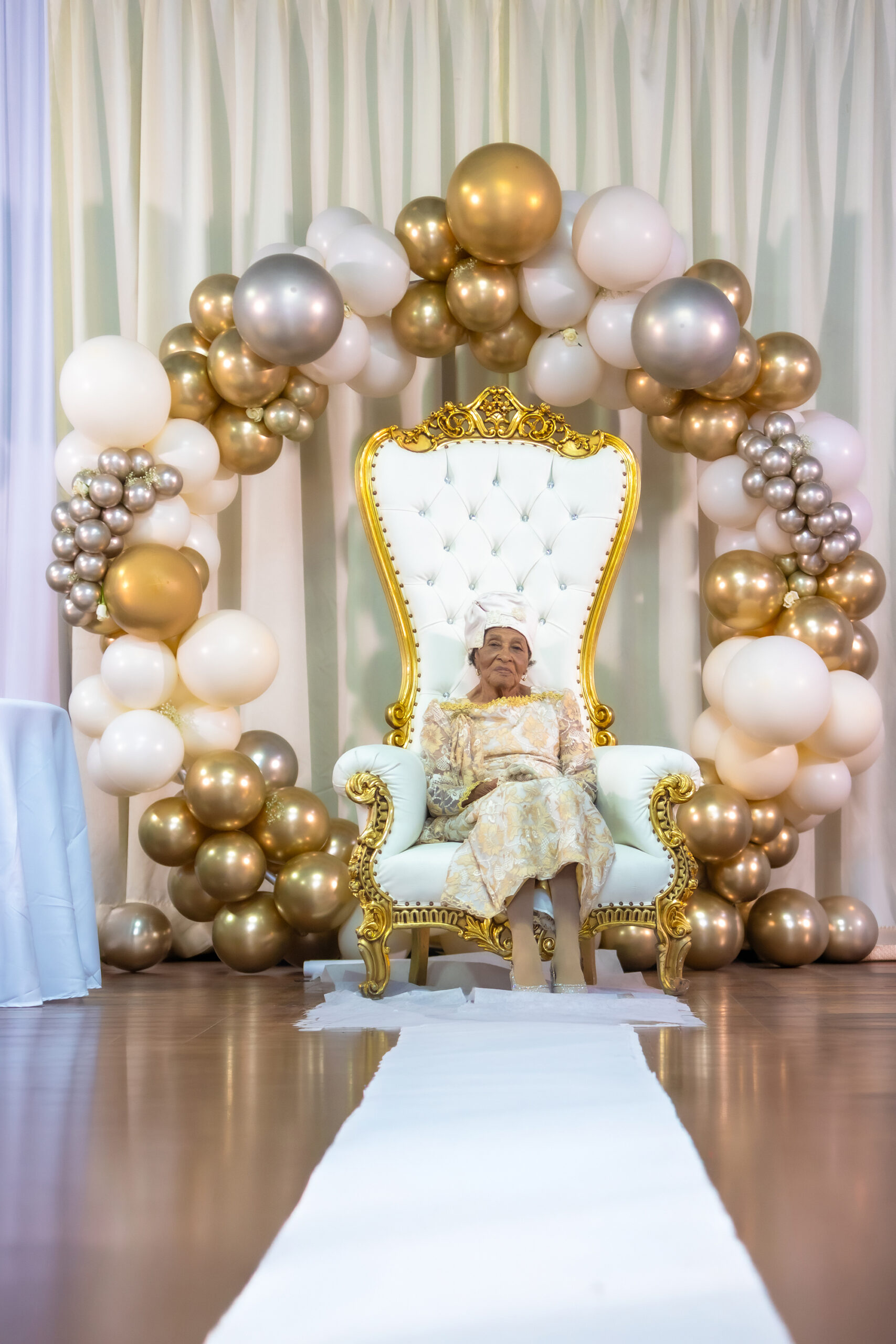 Custom balloon decor for 100th birthday party by Caliella