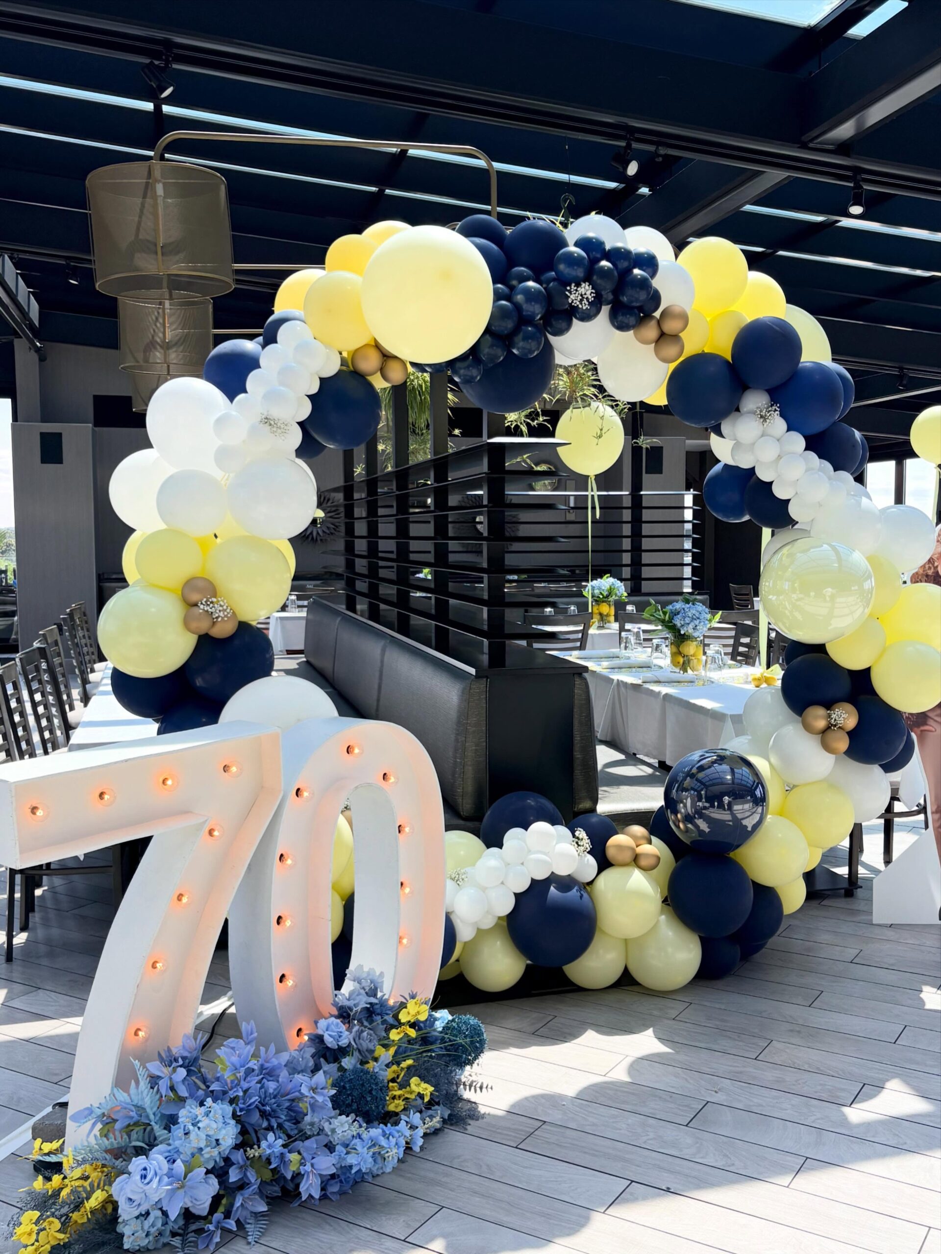 Custom balloon arch installation by Caliella in Rhode Island